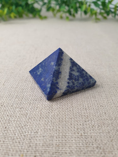 Lapis Lazuli Pyramid with greenery in background