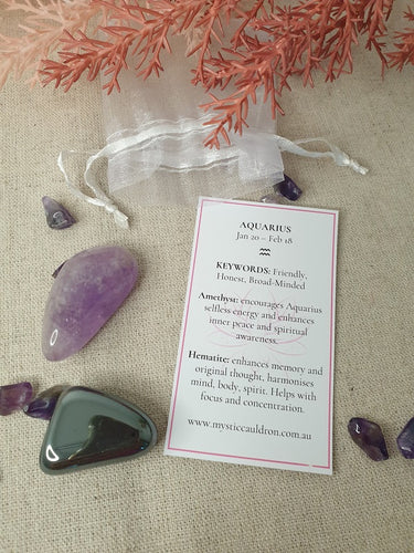 Aquarius Crystals and meaning card surrounded by crystal chips 