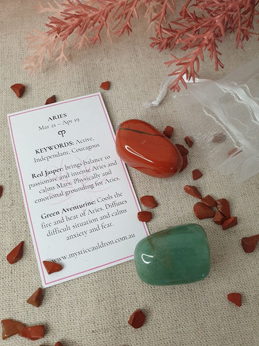 Aries Crystals and meaning card surrounded by crystal chips