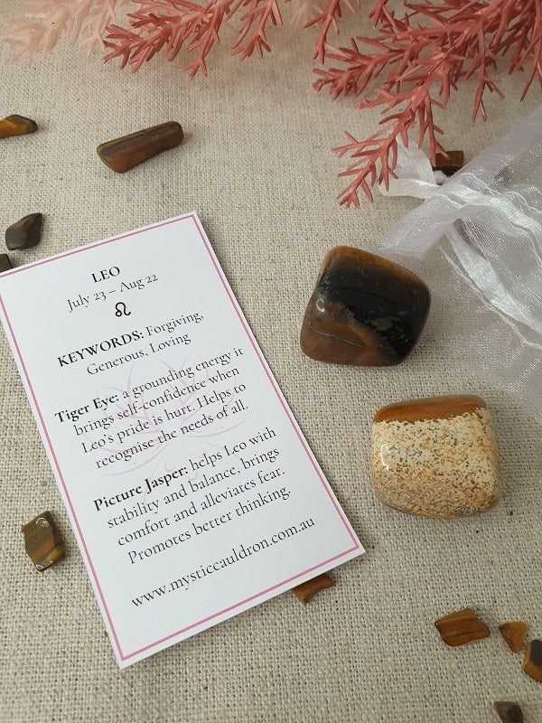 Leo Crystals and meaning card surrounded by crystal chips