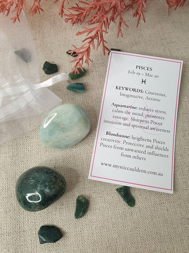 Pisces Crystals and meaning card surrounded by crystal chips