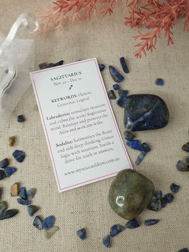 Sagittarius Crystals and meaning card surrounded by crystal chips 